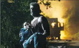  ??  ?? In “Logan, “Hugh Jackman as Logan/Wolverine tries to protect the young mutant Laura, played by Dafne Keen.