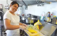  ?? SHARON MONTGOMERY-DUPE/CAPE BRETON POST ?? Rachel Aspacio, owner of Rachel’s Cuisine food truck located on the boardwalk at the Esplanade in Sydney, prepares fried rice before opening on Thursday of last week.