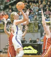  ?? Courtney Couey, Ringgold Tiger Shots ?? Ringgold’s Riley Nayadley pulls up for a shot during the Region 6-AAA title game against Sonoravill­e last Monday night at North Murray High School.