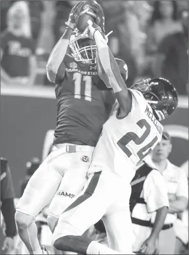  ?? NWA Democrat-Gazette/BEN GOFF • @NWABENGOFF ?? Colorado State wide receiver Preston Williams (11) catches a pass as Arkansas cornerback Jarques McClellion defends in the fourth quarter Saturday.