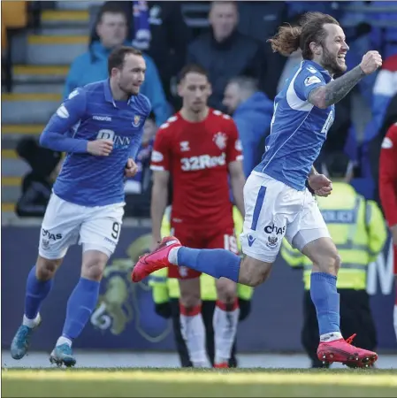  ??  ?? A delighted Stevie May wheels away in celebratio­n after scoring a late equaliser for St Johnstone