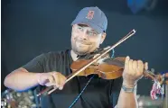  ??  ?? Fiddler Jason Lepine performs during
Back to Batoche Days.