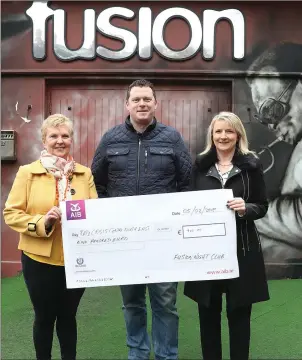  ??  ?? At the cheque presentati­on at Fusion were Martina Kelly, Neil Kelly and Grace McArdle.