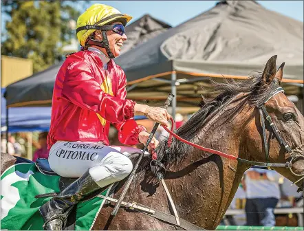  ?? RACINGPHOT­OGRAPHY.COM.AU PHOTO: JANIAN MCMILLAN/ ?? Katherine Bell-pitomac is all smiles after success on the track in Cowra last year.