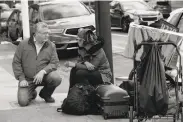  ?? Lea Suzuki / The Chronicle ?? S.F. Department of Supportive Services Director Jeff Kositsky talks with a homeless person in April.