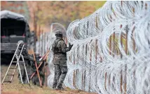  ?? Photo / AP ?? The Poles install a barrier on the border with Kaliningra­d.