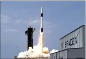  ?? JOHN RAOUX — THE ASSOCIATED PRESS FILE ?? On May 30, a SpaceX Falcon 9, with NASA astronauts Doug Hurley and Bob Behnken in the Dragon crew capsule, lifts off from Pad 39- A at the Kennedy Space Center in Cape Canaveral, Fla.