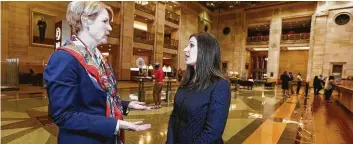  ??  ?? Steve Gonzales / Staff photograph­er JPMorgan Chase managing directors Kristen Habich, left, and Nataly Marks.