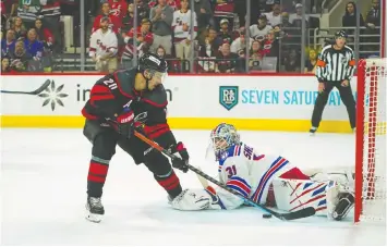  ?? JAMES GUILLORY/USA TODAY SPORTS ?? Carolina Hurricanes centre Sebastian Aho scores the tying goal on Rangers goalie Igor Shesterkin with 2:23 left to play in the third period.