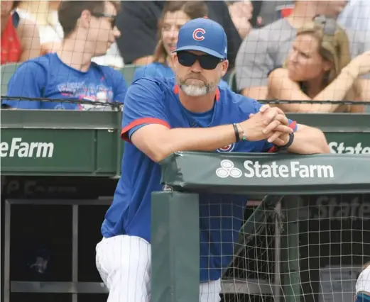  ?? PAUL BEATY/AP ?? Manager David Ross, who dealt with his own bout with COVID-19 last month, says the Cubs are facing ‘‘a challengin­g time’’ to end the season.