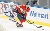  ?? MATIAS J. OCNER/MIAMI HERALD ?? Panthers’ Mike Matheson (19) wins possession of the puck against the Tampa Bay’s Ryan Callahan (24) in Saturday’s game. The game did not end in time for this edition. Results at sunsentine­l.com/panthers