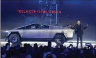  ?? RINGO H.W. CHIU / AP ?? Tesla CEO Elon Musk introduced the Cybertruck at its design studio last week. The much-hyped unveil of the electric pickup went off script when supposedly unbreakabl­e window glass shattered when hit with a large steel ball.