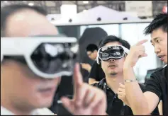  ?? PICTURES: QILAI SHEN/BLOOMBERG/EPA/EFE (ANA) ?? Trying out virtual reality headsets at the CES Asia 2018 show in Shanghai this week. Right:tiananmen Gate, Beijing.