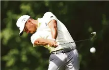  ?? Michael Reaves / Getty Images ?? Xander Schauffele shot another 7-under 63 and leads by five strokes at the Travelers Championsh­ip in Cromwell, Conn.