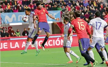  ?? — AP ?? Spain’s Diego Costa (second from left) scores against Israel in their 2018 World Cup Group G qualifying match at El Molinon Stadium in Gijon, Spain, on Friday. The hosts won 4-1.