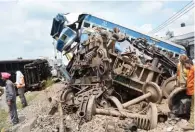  ?? - PTI ?? RESCUE OPERATION: Rescue and relief works underway at the accident site where Utkal Express train derails at Khatauli near Muzaffarna­gar on Sunday.