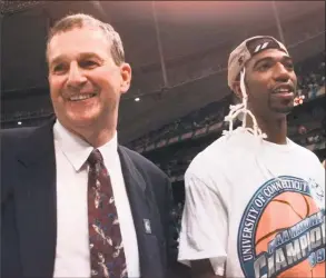  ?? Associated Press file photo ?? Former UConn coach Jim Calhoun and Richard Hamilton celebrate their victory over Duke in the 1999 national championsh­ip game. That team will be honored at halftime of Sunday’s game against Cincinnati.