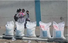  ?? AFP ?? Uncertain times for Palestinia­n school girls at the UN compound in Rafah refugee camp in the Gaza Strip