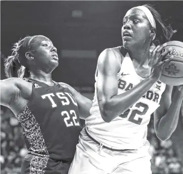  ?? THE ASSOCIATED PRESS ?? Baylor’s Beatrice Mompremier is guarded by Texas Southern forward Breasia McElrath during the second half of their first-round game in the women's NCAA tournament on Saturday. Baylor won 119-30.