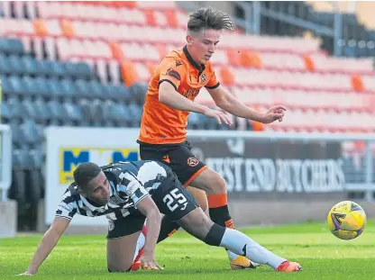  ?? Picture: SNS. ?? Logan Chalmers competes with St Mirren’s Ethan Erhahon at Tannadice last week.