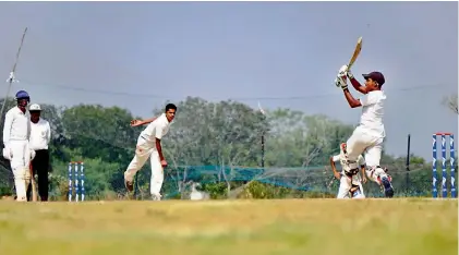  ??  ?? Action from the match between St Peter’s High School and Global Internatio­nal School during the Louis Emanuel inter-schools Premier League cricket tournament at the Hakimpet ground in Hyderabad.