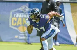  ?? KEVIN RICHARDSON/BALTIMORE SUN ?? Star running back J.K. Dobbins’ return created some excitement at Ravens training camp on Monday, especially for a team in need of a top running back, but this offense will suffer without left tackle Ronnie Stanley, columnist Mike Preston writes.