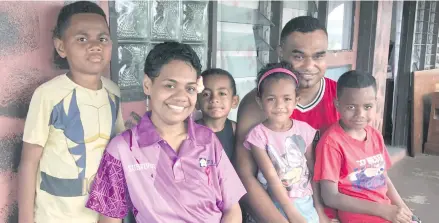  ?? Photo: Losirene Lacanivalu. ?? Cancer survivor Asenaca Driso with her husband Jovilisi Rayalu Ducia and their children at their family home in Nailuva, Suva.