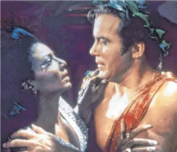  ?? FOTO: THE LEGACY COLLECTION/IMAGO ?? Damals ein Skandal: Captain Kirk (William Shatner) und Uhura (Nichelle Nichols) in der Star Trek-Folge „Platons Stiefkinde­r“, hier kurz vor dem Kuss, der Amerika aufwühlen sollte.