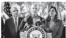  ?? JOSE A IGLESIAS jiglesias@elnuevoher­ald.com ?? Sen. Rick Scott speaks during a press conference in front of Mondongo’s Restaurant in Doral, flanked by U.S. Reps. Carlos Gimenez, left, and Maria Elvira Salazar, right.