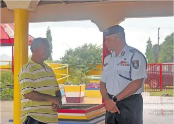  ?? Photo: Lusiana Banuve ?? Commission­er of Police Brigadier-General Sitiveni Qiliho listens to Votualevu Tirath Dam Mandir treasurer Shiu Chandraon December 21, 2017.