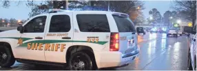  ?? PHILLIP ?? A Shelby County Sheriff’s Office vehicle sits outside the Garden Tree hotel where a person was shot and killed by SCSO deputies on Thursday, Feb. 7. JACKSON / COMMERCIAL APPEAL