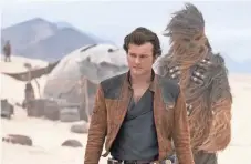  ?? JONATHAN OLLEY ?? Young Han Solo (Alden Ehrenreich) goes on his first mission with new pal Chewbacca (Joonas Suotamo) in “Solo: A Star Wars Story,” out May 25.