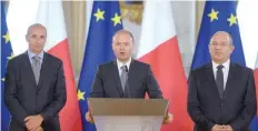  ?? — AFP ?? Malta’s Prime Minister Joseph Muscat (C) addresses the media on Wednesday in Valletta.