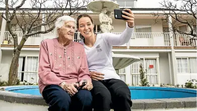  ?? BRADEN FASTIER/STUFF ?? Technology, training techniques and travel times have changed but the notion of hard work still pays off in the pool, says the country’s oldest living Olympian, Ngaire Galloway. Here, she has a selfie taken with her granddaugh­ter Gina Galloway, who is set to compete at the Youth Olympic Games in Buenos Aires next month.