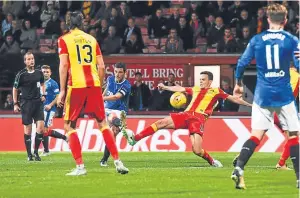  ?? Picture: SNS. ?? Graham Dorrans lashes home Rangers’ equaliser 13 minutes from time.