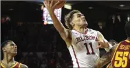  ?? J PAT CARTER / GETTY IMAGES ?? Oklahoma guard Trae Young’s unorthodox methods, slight build and his high-volume 3-point shooting have led to comparison­s to Stephen Curry.