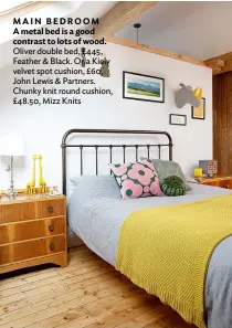  ??  ?? MAIN BEDROOM A metal bed is a good contrast to lots of wood. Oliver double bed, £445, Feather & Black. Orla Kiely velvet spot cushion, £60, John Lewis & Partners. Chunky knit round cushion, £48.50, Mizz Knits