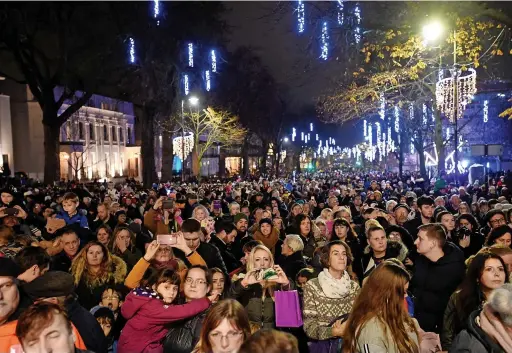  ?? ?? People gathering to watch 2019’s Christmas lights switch-on in the town centre