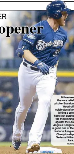  ?? REUTERS ?? Milwaukee Brewers relief pitcher Brandon Woodruff celebrates after hitting a solo home run during the third inning against the Los Angeles Dodgers in game one of the National League Championsh­ip Series at Miller Park.