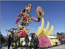  ??  ?? The 24 Hour Fitness USA, Inc. float rolls down Colorado Boulevard during the 130th Rose Parade in Pasadena, Calif., Tuesday.