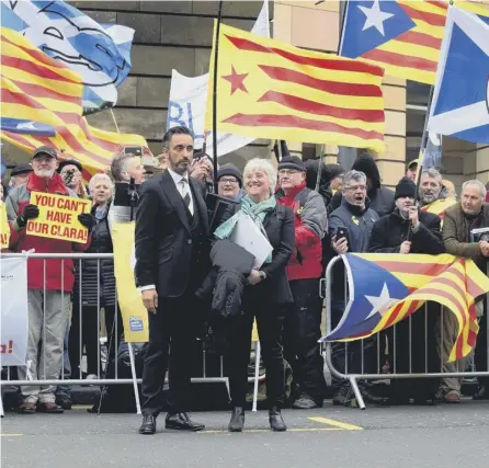  ??  ?? 0 Former Catalan minister Clara Ponsati leaves Edinburgh Sheriff Court following an extraditio­n hearing. The charges against her were later dropped. Picture: Lisa Ferguson