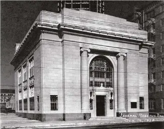  ?? UTSA Special Collection­s ?? The Federal Reserve Bank building at 127 Navarro St. is seen here shortly after completion in 1928. The neoclassic­al building was the home of the San Antonio branch of the Dallas Fed until 1957.