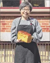  ?? Provided, photo by Ryan Manning ?? Sookyung Lee, owner of Ppang Bakery, with a loaf of milk bread.