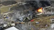  ?? GENE J. PUSKAR — THE ASSOCIATED PRESS FILE ?? Portions of a Norfolk Southern freight train that derailed in East Palestine, Ohio, are still on fire on Feb. 4, a day after the accident.