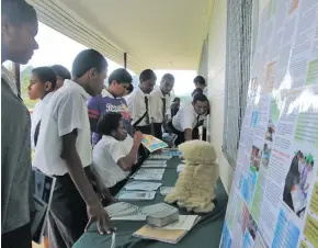  ?? Photo: Parliament of Fiji ?? Students of Nadarivatu High School looking through the Parliament displays.