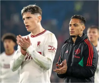  ?? ?? New low: Antony, far right, who cost £85m and has scored just one league goal this season, applauds the fans after United’s crushing 4-0 defeat at Crystal Palace. The result has piled the pressure on manager Erik ten Hag, below