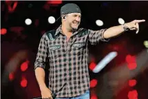  ?? Yi-Chin Lee/Staff photograph­er ?? Luke Bryan’s 10th performanc­e at the Houston Livestock Show and Rodeo drew a paid attendance of 74,779 on Sunday.