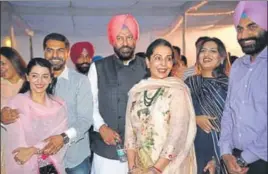  ??  ?? ■ Rana Gurmeet Singh Sodhi with his family members after the swearingin ceremony at the Punjab Raj Bhawan on Saturday.