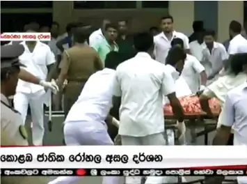  ?? — Reuters photo ?? A victim is rushed to a hospital after explosions hit churches and hotels in Colombo.