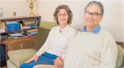  ??  ?? Nigel Foster, here with wife Lynne at home in Auckland, is amazed his Navy ID card is still recognisab­le.